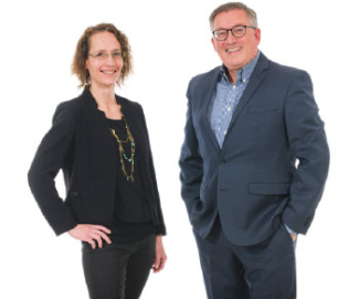 Two smiling Western Financial Group insurance agents