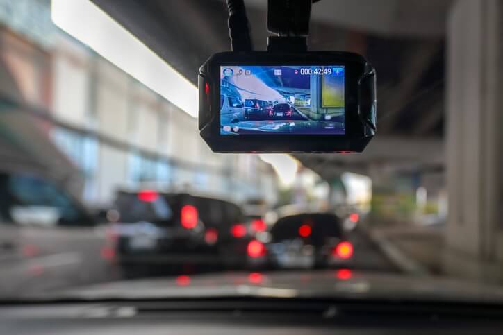 View from the drivers seat of a car, looking out the front windshield with a dashboard camera