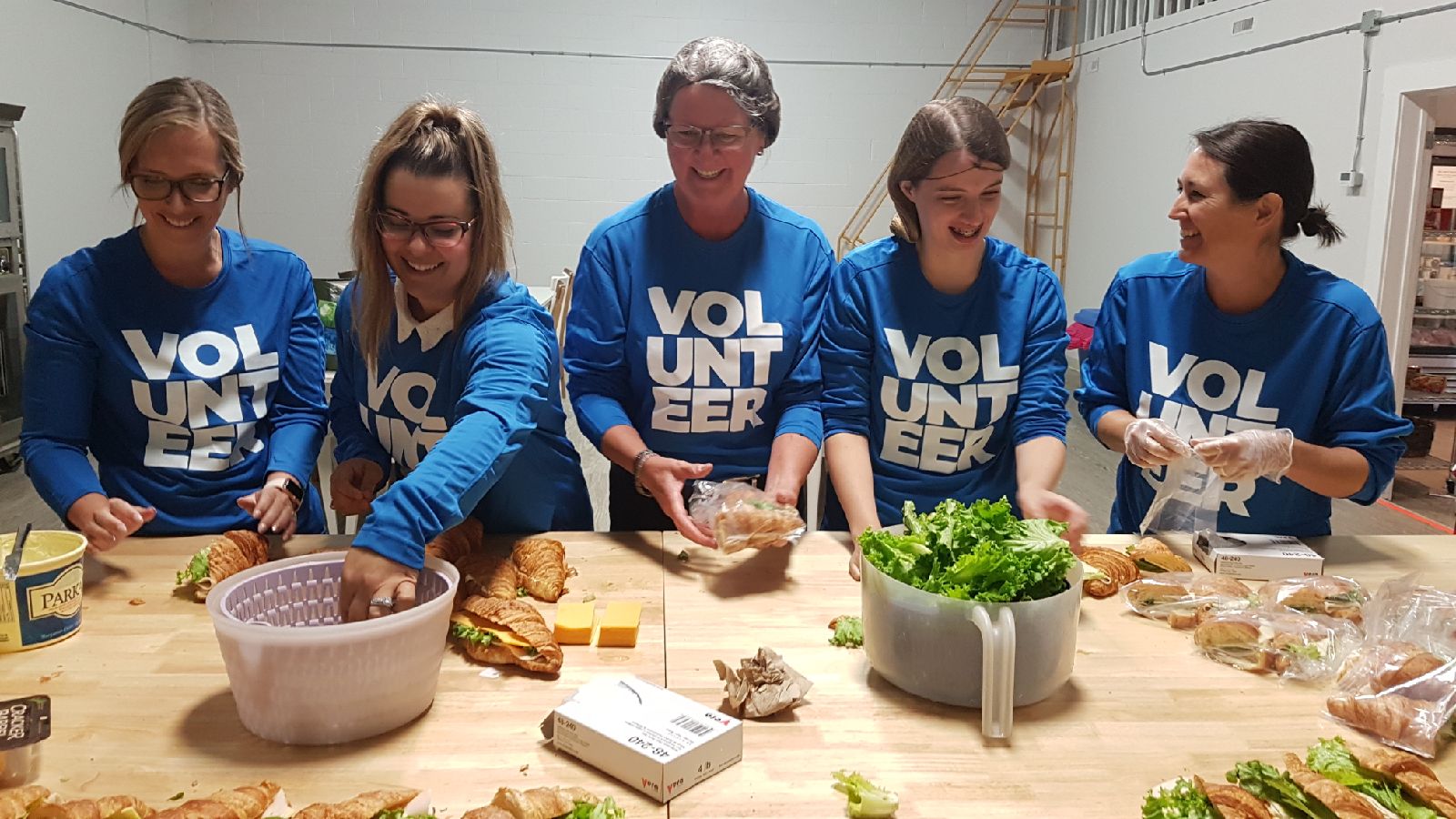 A team of Western Financial Group volunteers helps to build sandwiches for local not-for-profit Food for Thought