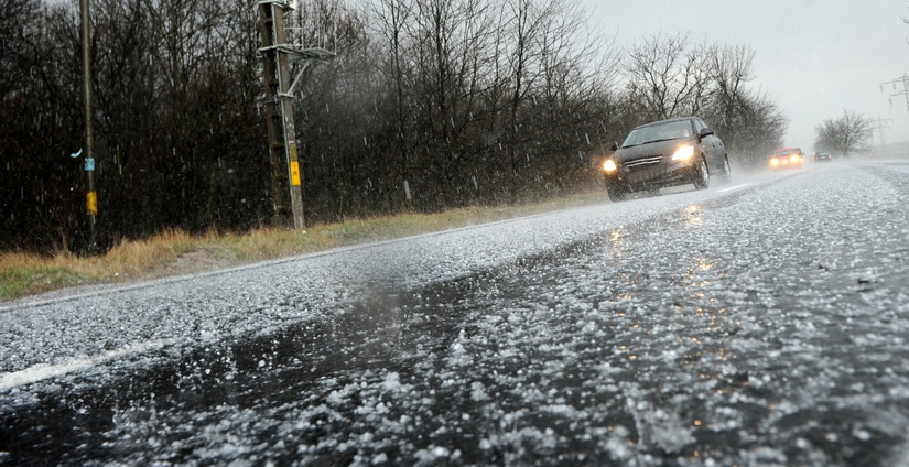 Car driving in a hail storm