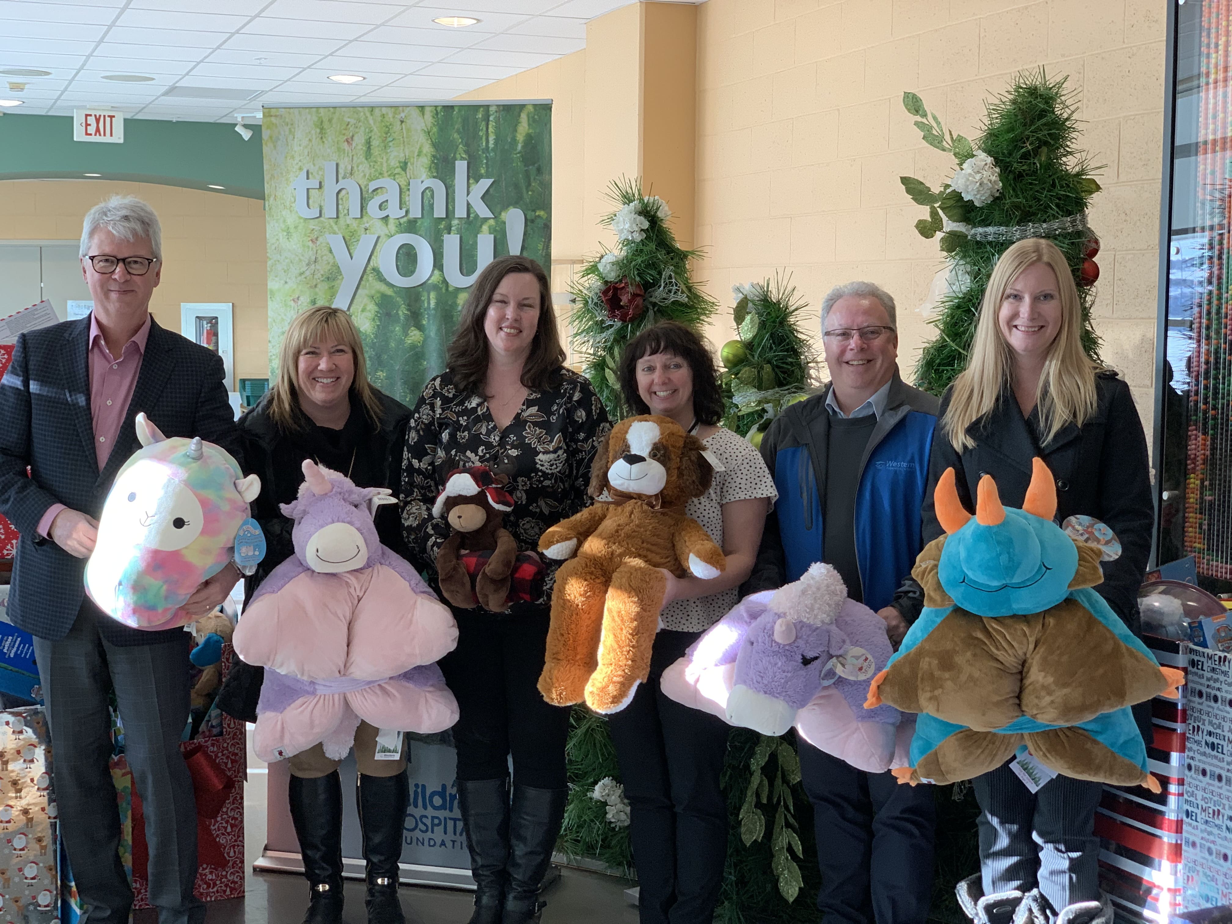 A team comprised of Western executives and head office staff deliver toys to the Alberta Children's Hospital