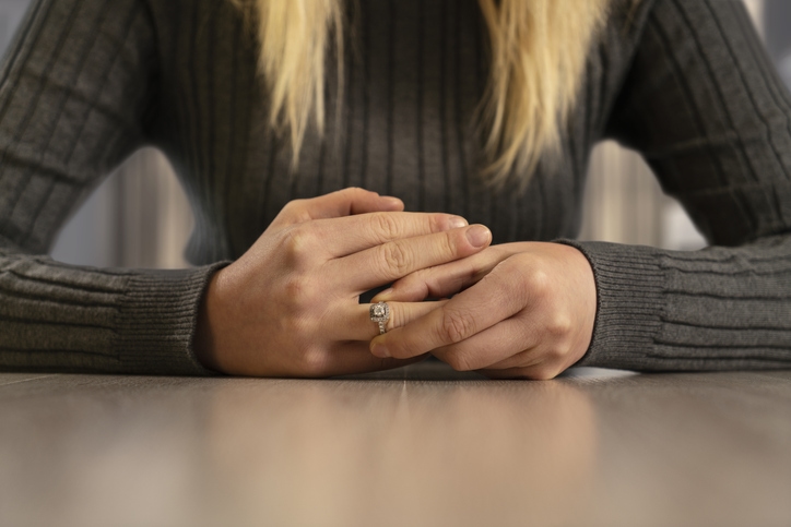 Young woman wearing an expensive ring on her finger