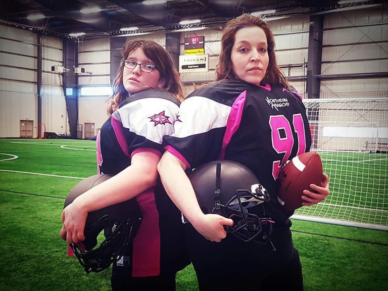 Kathy Best and her daughter Quinn practice ahead of their first game.