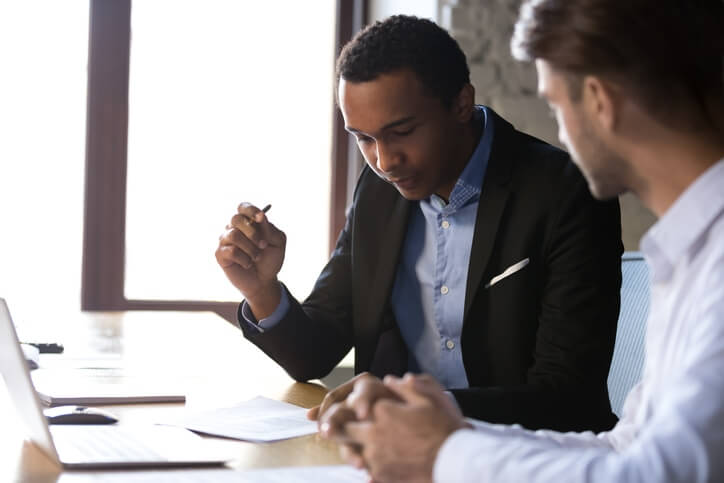 Young man looking at insurance documents