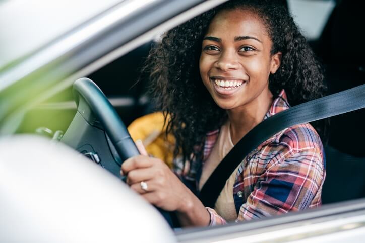 Young women in driver seat of her car