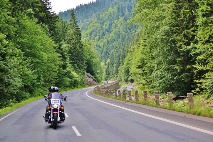 Motorcyclist driving on a mountain highway