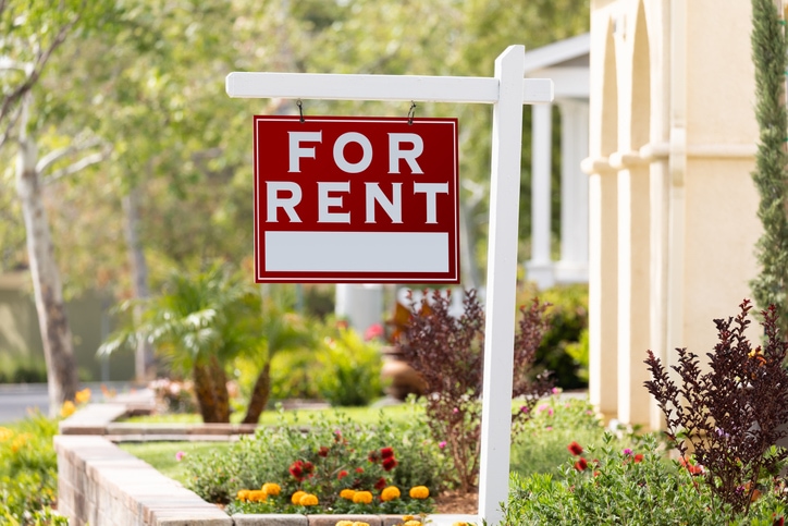 For rent sign in house's front yard