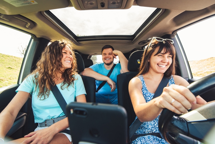 Friends driving in a car