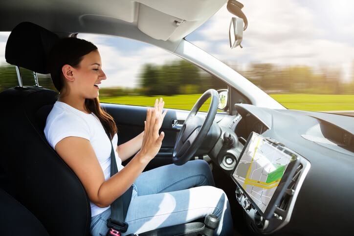 Young woman riding in a self driving car