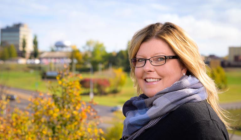 Val Wasmuth, Western's North Battleford branch manager, is photographed overlooking the skyline of North Battleford, Saskatchewan