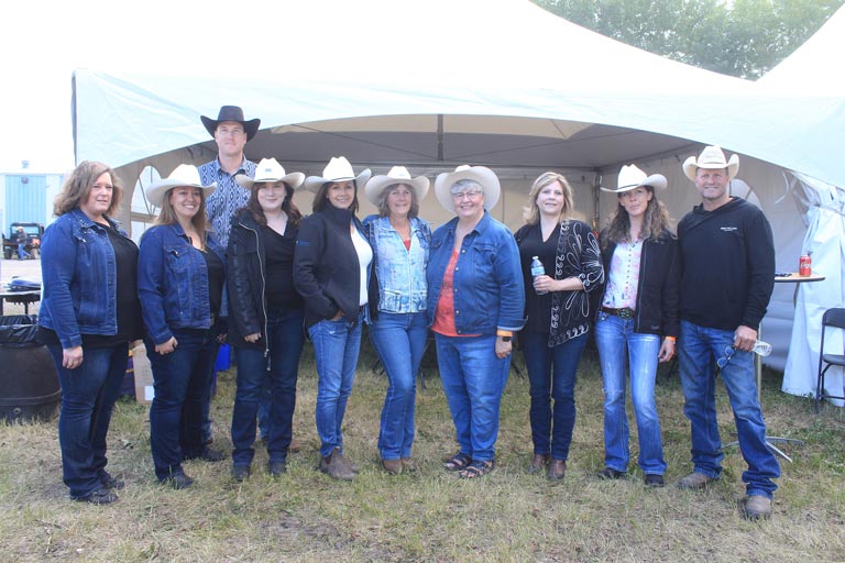 The Western Financial Group team in High River is joined by chuckwagon drivers Jordie Fike and Jason Glass during Guy Weadick Days 2019