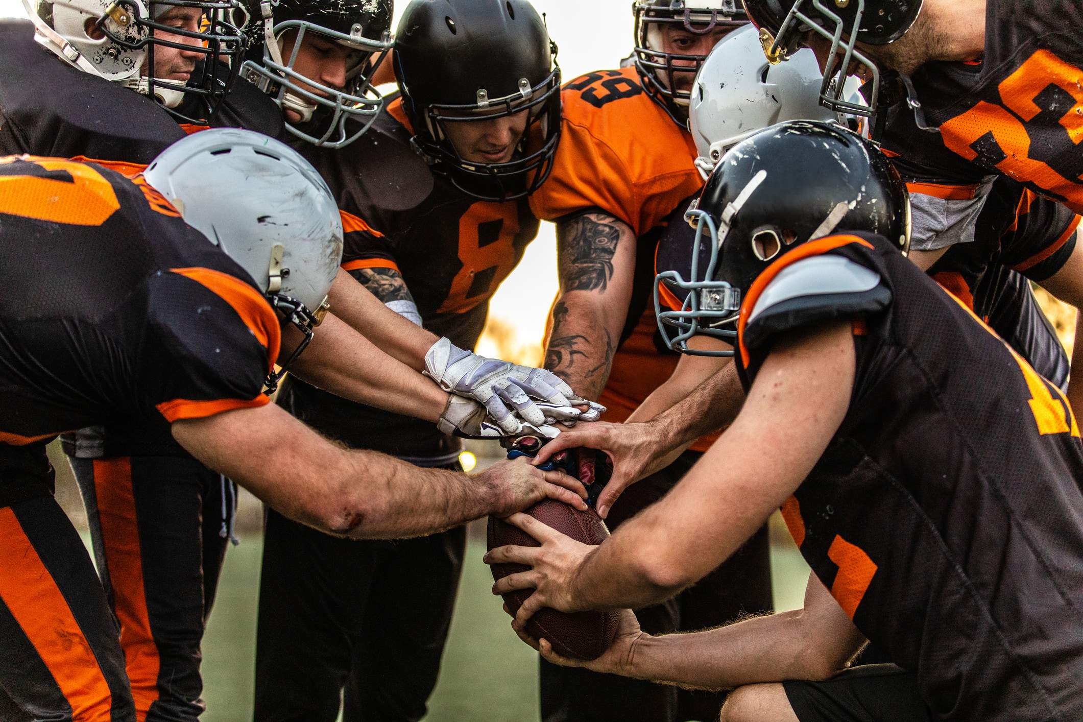 Football team in huddle before the big game