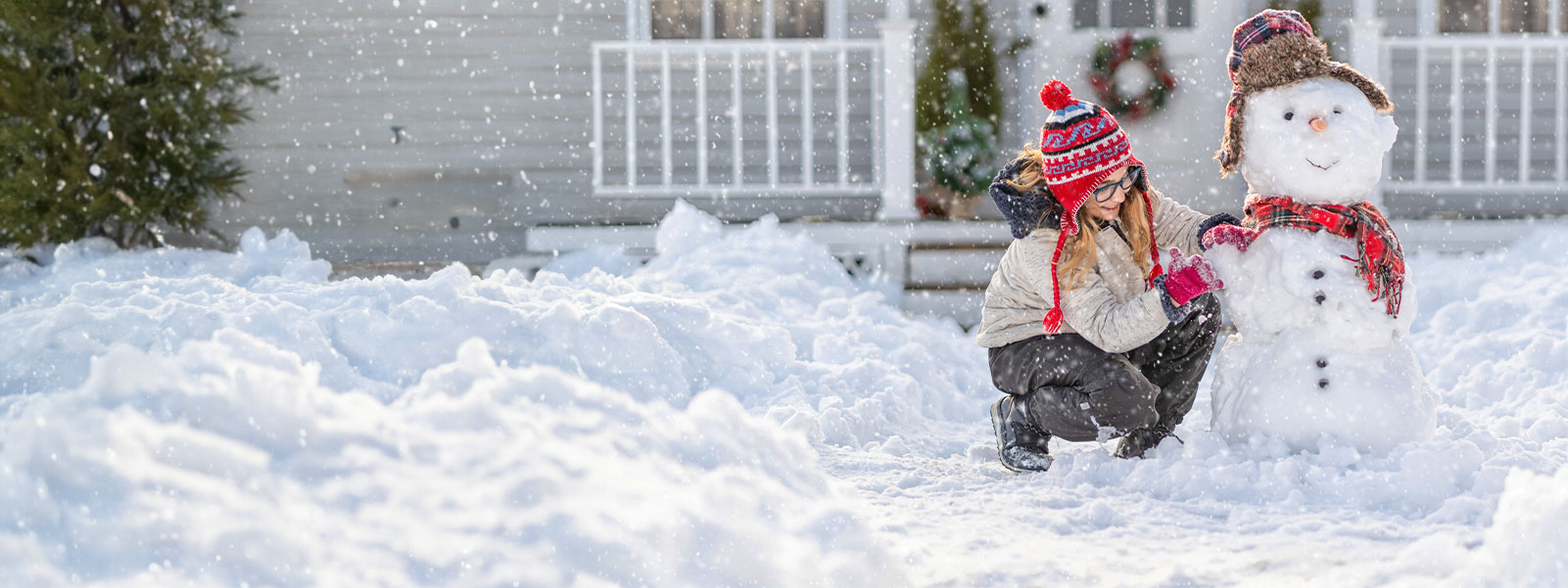 Family enjoying winter at home, representing trusted home insurance protection from Western Financial Group